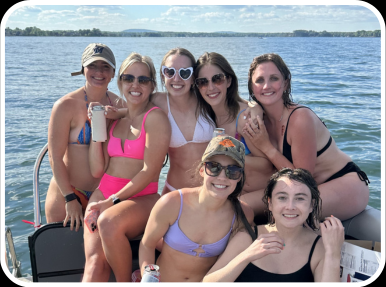 two girls having the time of their lives during their sunset cruise aboard carolina cruising charters' boat rental in lake norman, north carolina